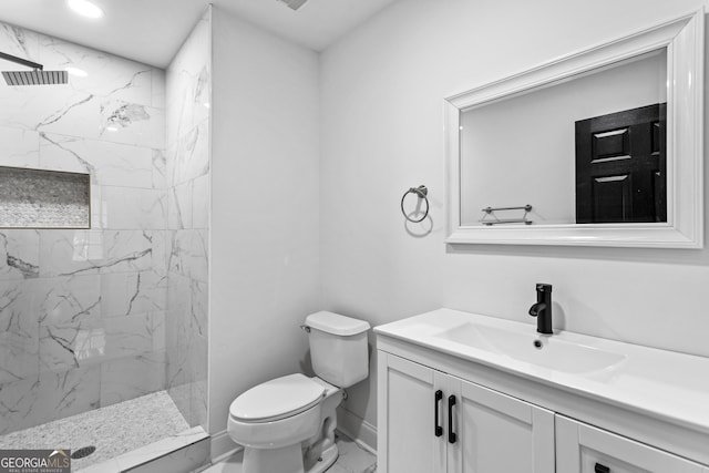 849 Wood St NW, Atlanta, GA 30318 - bathroom with a marble finish shower, vanity, marble finish floor, baseboards, and toilet