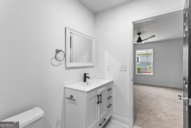 849 Wood St NW, Atlanta, GA 30318 - half bathroom with vanity, toilet, baseboards, and a ceiling fan