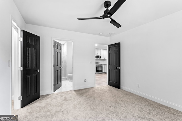 849 Wood St NW, Atlanta, GA 30318 - unfurnished bedroom with ensuite bath, ceiling fan, light colored carpet, baseboards, and visible vents