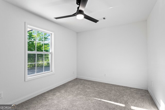 849 Wood St NW, Atlanta, GA 30318 - carpeted empty room featuring visible vents, a ceiling fan, and baseboards