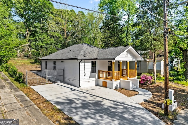849 Wood St NW, Atlanta, GA 30318 - view of front of home with crawl space, driveway, fence, a porch, and roof with shingles