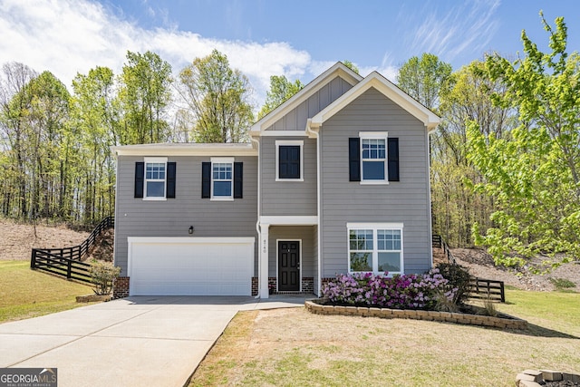 4740 Alford Commons, Cumming, GA 30028 - view of front of home with an attached garage, board and batten siding, and driveway