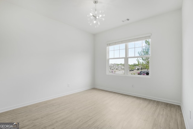 4740 Alford Commons, Cumming, GA 30028 - unfurnished room featuring a chandelier and light wood-style floors