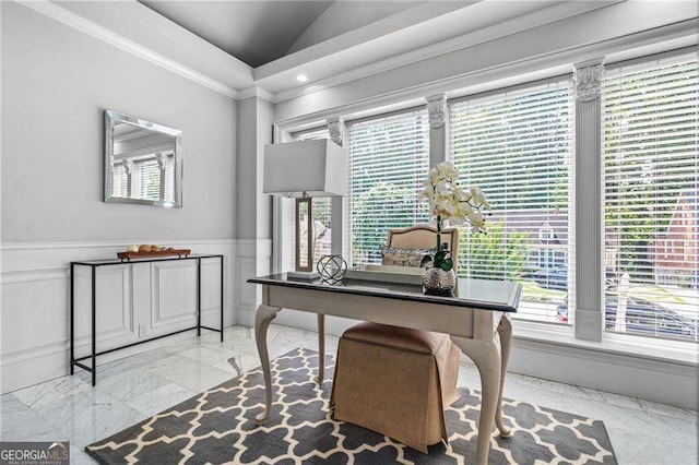 office space with a wainscoted wall, crown molding, lofted ceiling, marble finish floor, and a decorative wall