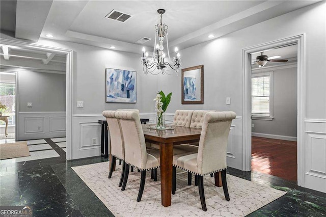 dining room featuring a decorative wall, ceiling fan with notable chandelier, a wainscoted wall, visible vents, and recessed lighting