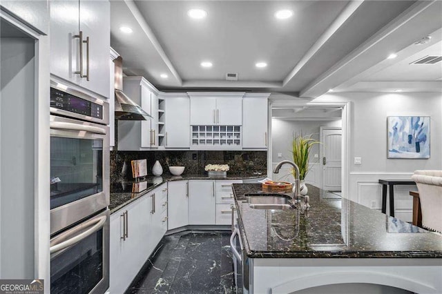 kitchen featuring recessed lighting, open shelves, visible vents, a sink, and tasteful backsplash