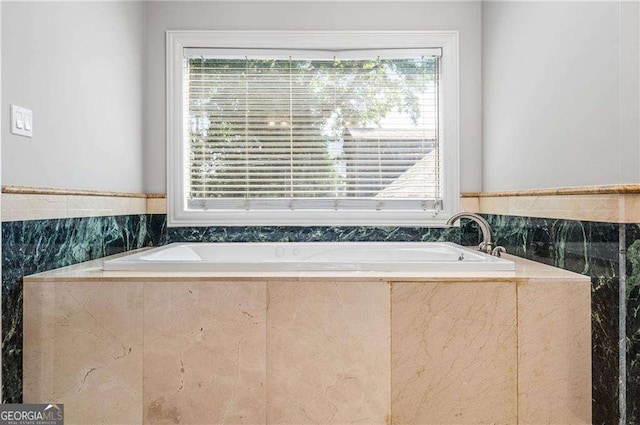 full bathroom featuring a bath