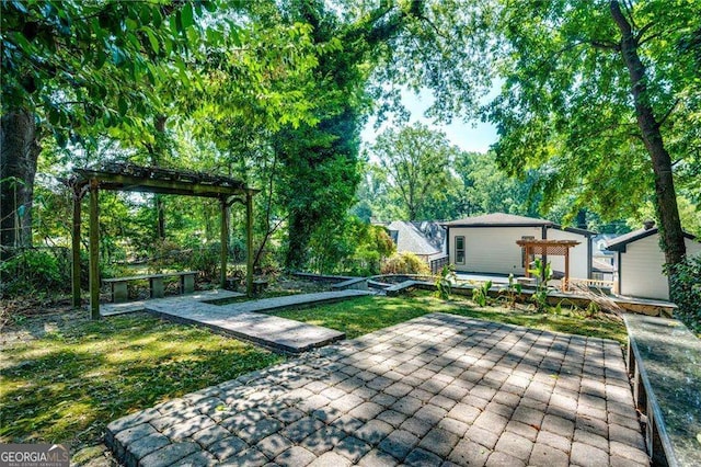 view of yard with a pergola and a patio area
