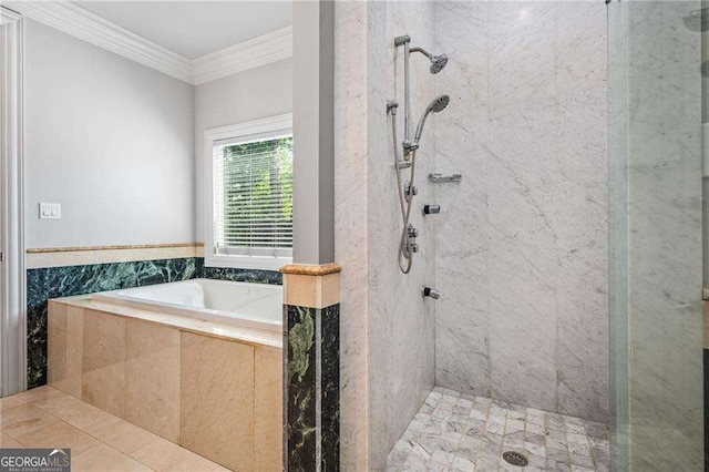 bathroom with a garden tub, ornamental molding, and tiled shower