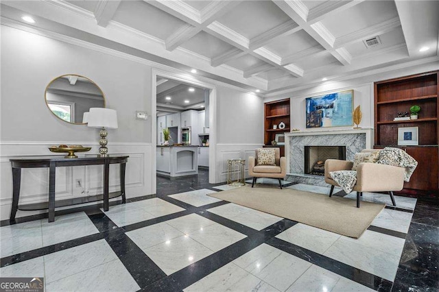 living room featuring crown molding, visible vents, recessed lighting, a decorative wall, and a high end fireplace