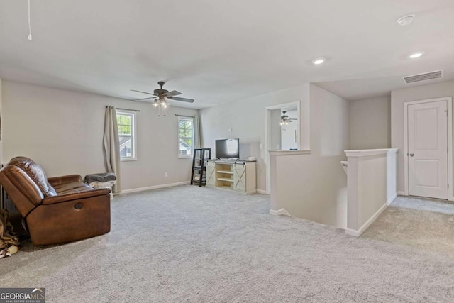 carpeted living room with baseboards, visible vents, recessed lighting, and ceiling fan