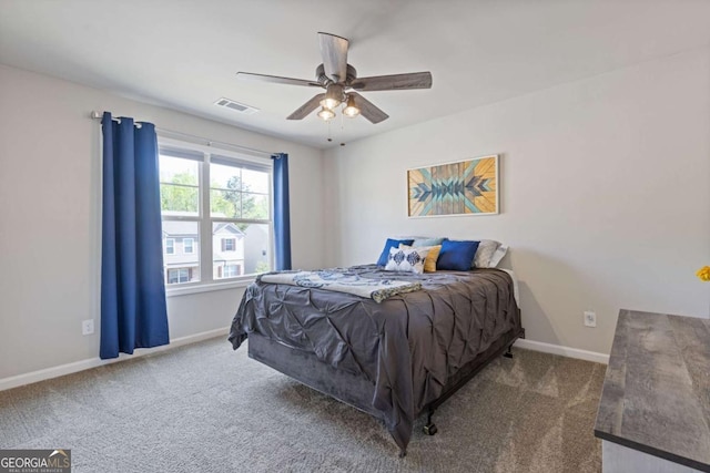 carpeted bedroom with baseboards, visible vents, and ceiling fan