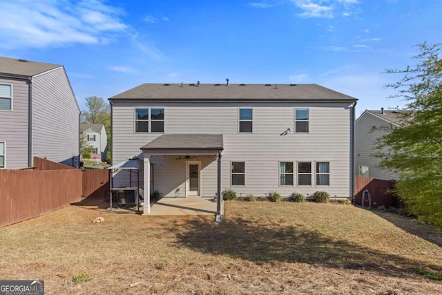 back of house with cooling unit, a ceiling fan, a patio, and fence