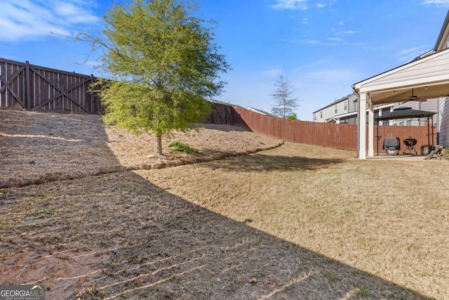 view of yard with a fenced backyard