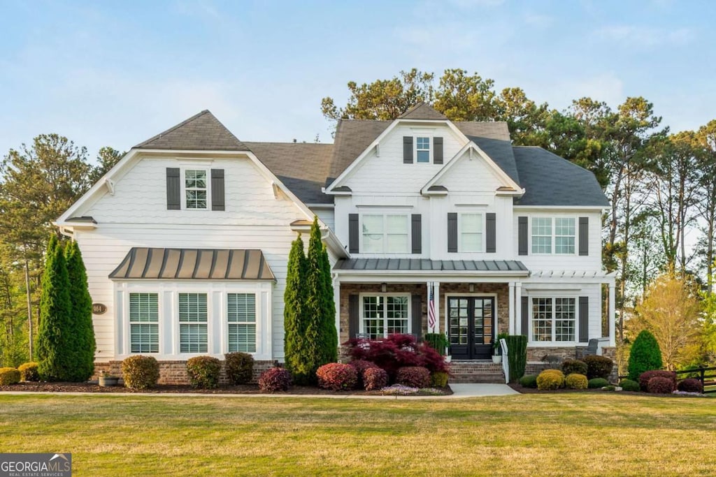 984 Hunter Way, Milton, GA 30004 - view of front of house featuring a standing seam roof, a front yard, metal roof, and french doors