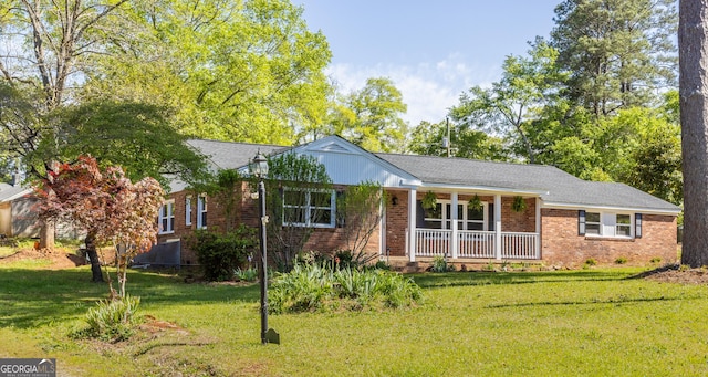 710 Avalon Rd, Thomaston, GA 30286 - ranch-style home with covered porch, a front yard, and brick siding