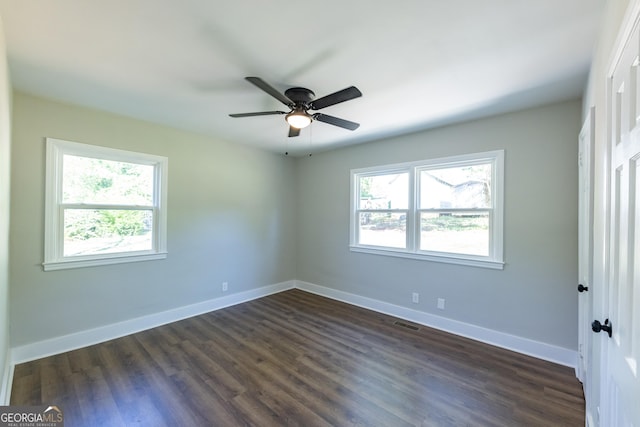 710 Avalon Rd, Thomaston, GA 30286 - unfurnished bedroom with baseboards and dark wood-type flooring
