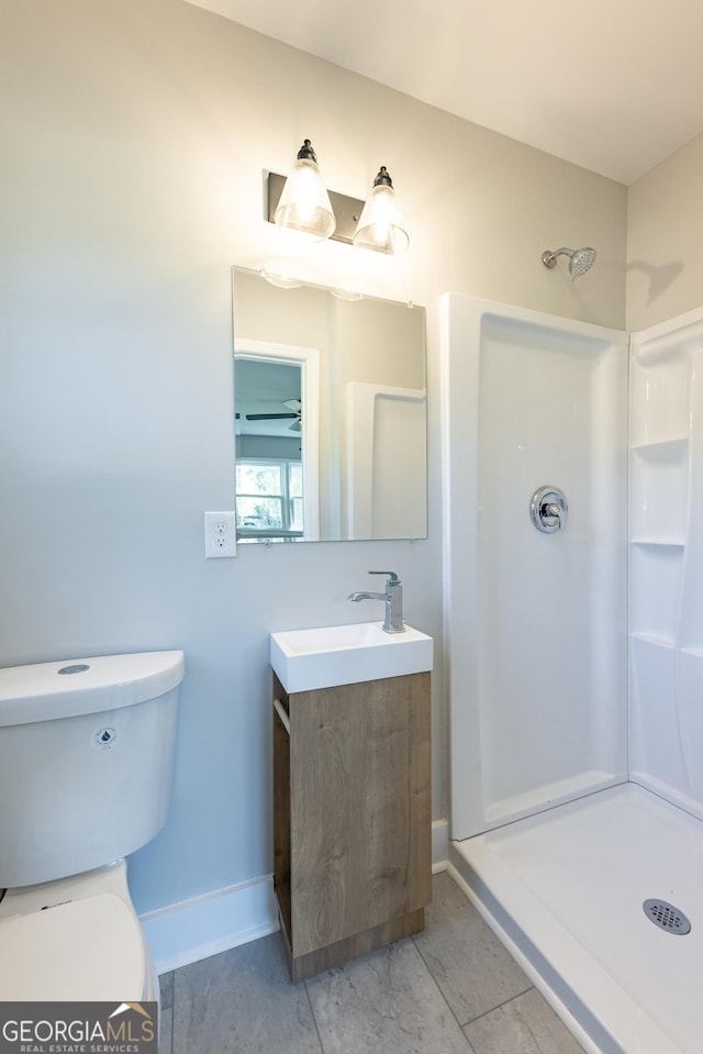 710 Avalon Rd, Thomaston, GA 30286 - full bath featuring a shower, toilet, vanity, and baseboards