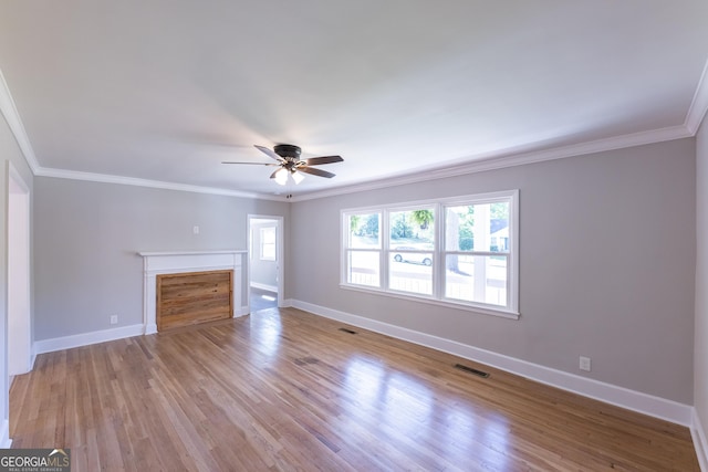 710 Avalon Rd, Thomaston, GA 30286 - unfurnished living room featuring plenty of natural light, a ceiling fan, crown molding, and baseboards