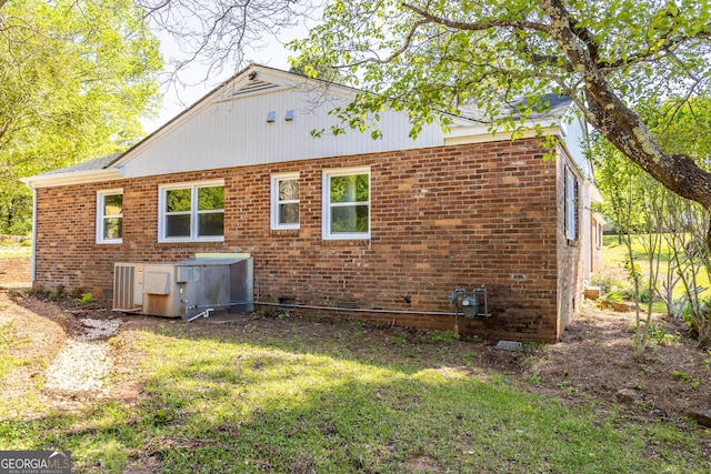 710 Avalon Rd, Thomaston, GA 30286 - back of property featuring brick siding, a yard, crawl space, and roof with shingles