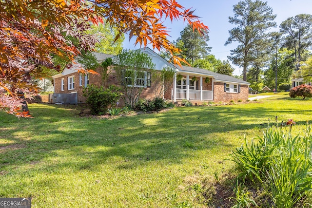 710 Avalon Rd, Thomaston, GA 30286 - ranch-style home featuring brick siding, a front yard, and a porch