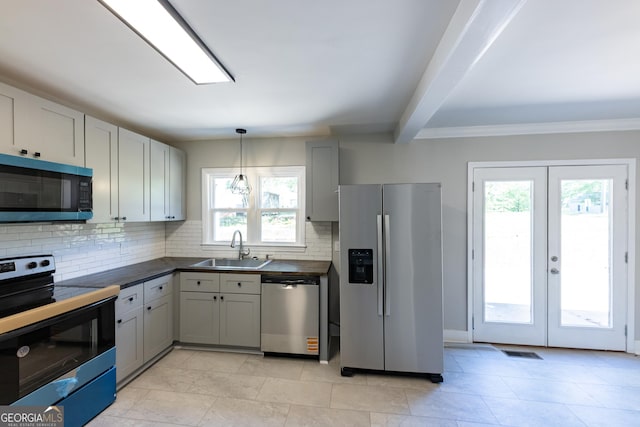 710 Avalon Rd, Thomaston, GA 30286 - kitchen featuring stainless steel appliances, a sink, dark countertops, backsplash, and french doors
