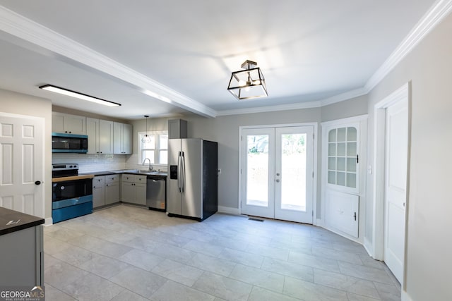 710 Avalon Rd, Thomaston, GA 30286 - kitchen with stainless steel appliances, gray cabinetry, dark countertops, french doors, and tasteful backsplash