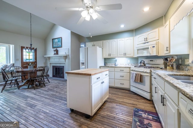 kitchen featuring a ceiling fan, white appliances, dark wood-type flooring, butcher block countertops, and white cabinetry