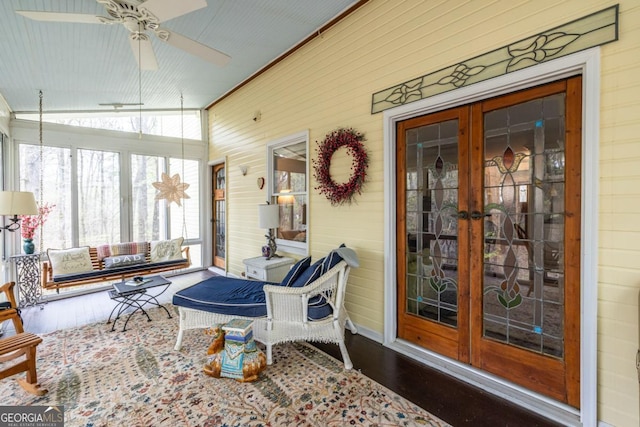 sunroom featuring french doors and a ceiling fan