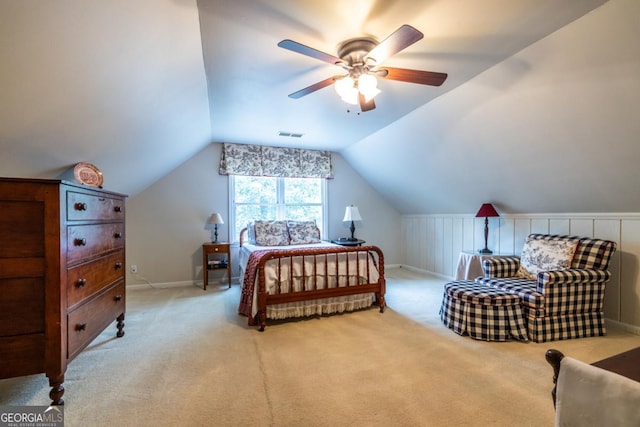 bedroom featuring vaulted ceiling, a ceiling fan, light carpet, baseboards, and visible vents