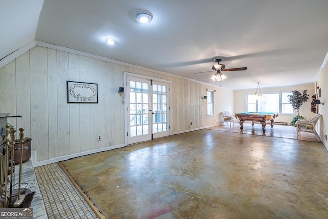 game room with concrete floors, crown molding, plenty of natural light, and pool table