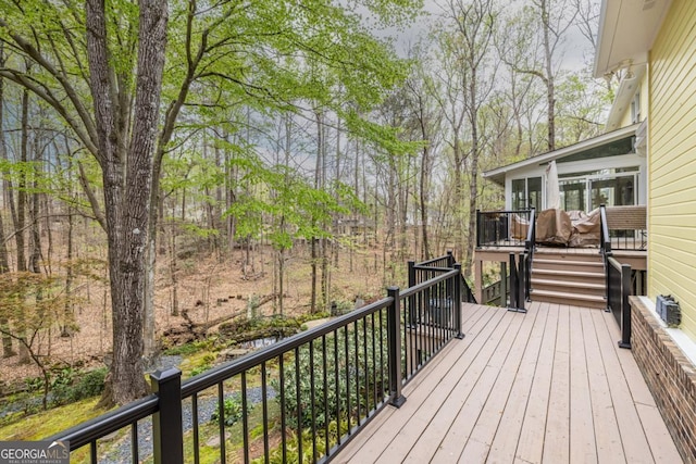 wooden deck featuring stairs