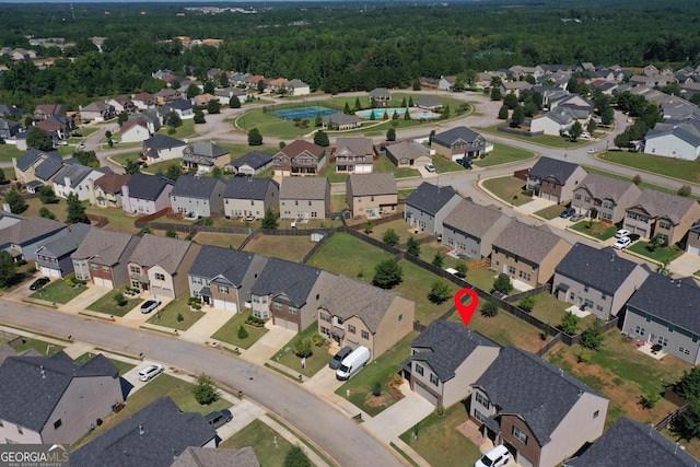 bird's eye view with a forest view and a residential view