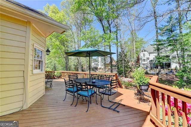 deck featuring outdoor dining area