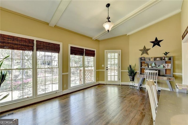 interior space featuring visible vents, vaulted ceiling with beams, and wood finished floors