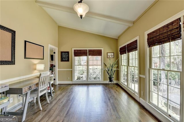 office area featuring baseboards, vaulted ceiling with beams, wood finished floors, and a healthy amount of sunlight