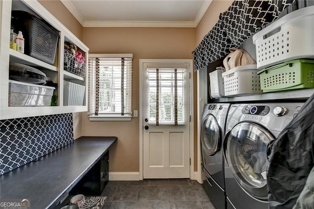 laundry room with washing machine and dryer, baseboards, laundry area, and ornamental molding