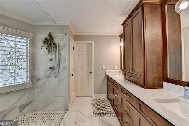 full bathroom featuring a marble finish shower, a sink, double vanity, marble finish floor, and crown molding