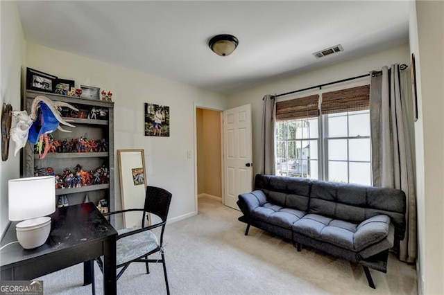 carpeted home office featuring baseboards and visible vents