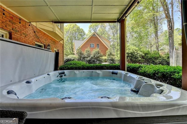 exterior space with a hot tub