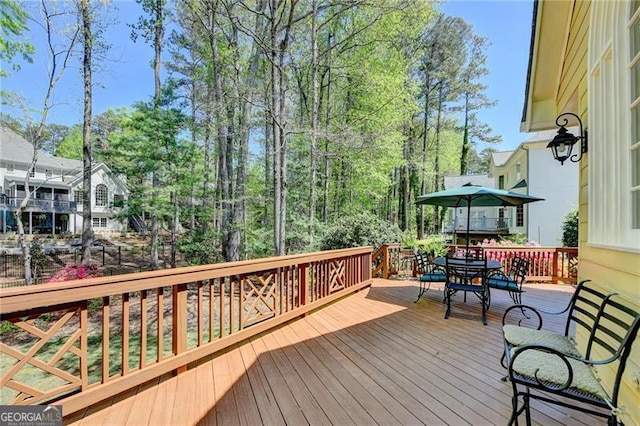 wooden deck featuring outdoor dining space