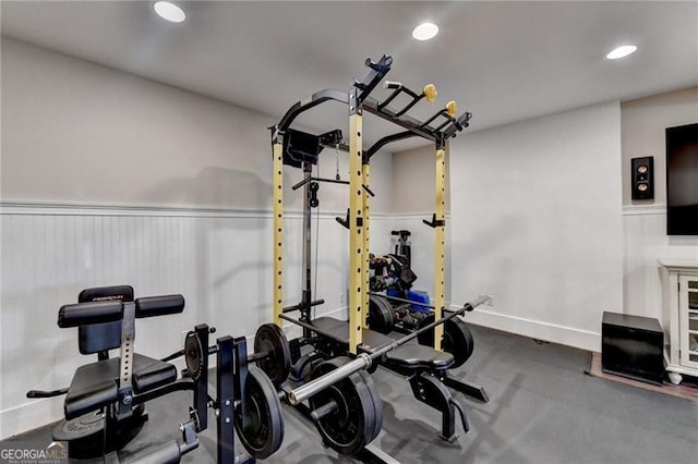 workout room featuring baseboards and recessed lighting