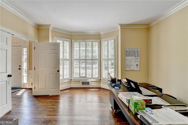 interior space featuring wood finished floors, visible vents, and ornamental molding