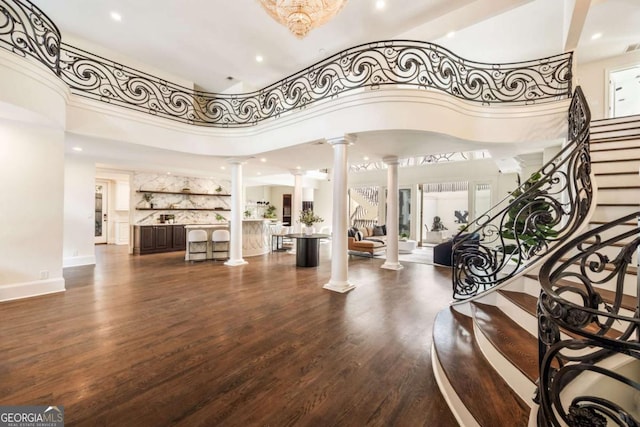 3511 Roxboro Rd NE, Atlanta, GA 30326 - entrance foyer with decorative columns, a towering ceiling, recessed lighting, wood finished floors, and stairway