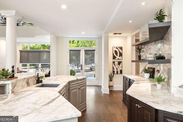 3511 Roxboro Rd NE, Atlanta, GA 30326 - kitchen with open shelves, a sink, dark wood-style flooring, visible vents, and ornate columns