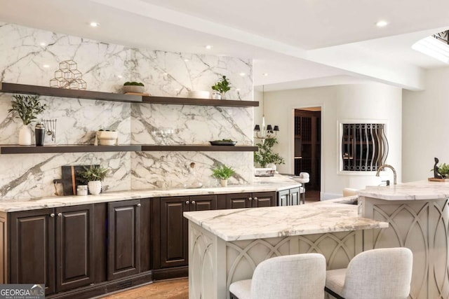 3511 Roxboro Rd NE, Atlanta, GA 30326 - bar with decorative backsplash, recessed lighting, and light wood-style flooring