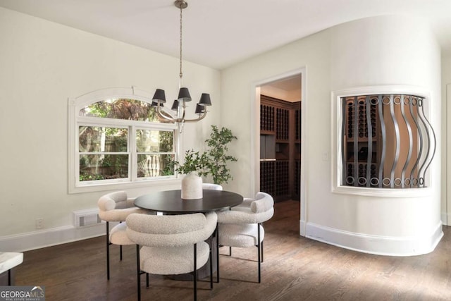 3511 Roxboro Rd NE, Atlanta, GA 30326 - dining room with visible vents, baseboards, dark wood-style flooring, and an inviting chandelier