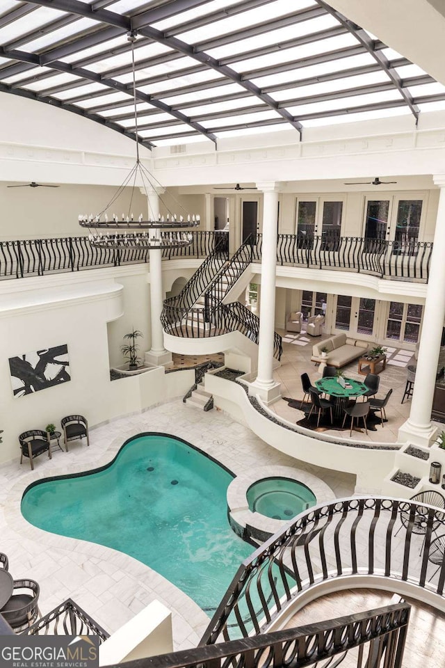 3511 Roxboro Rd NE, Atlanta, GA 30326 - view of swimming pool featuring stairs, a patio area, and a pool with connected hot tub