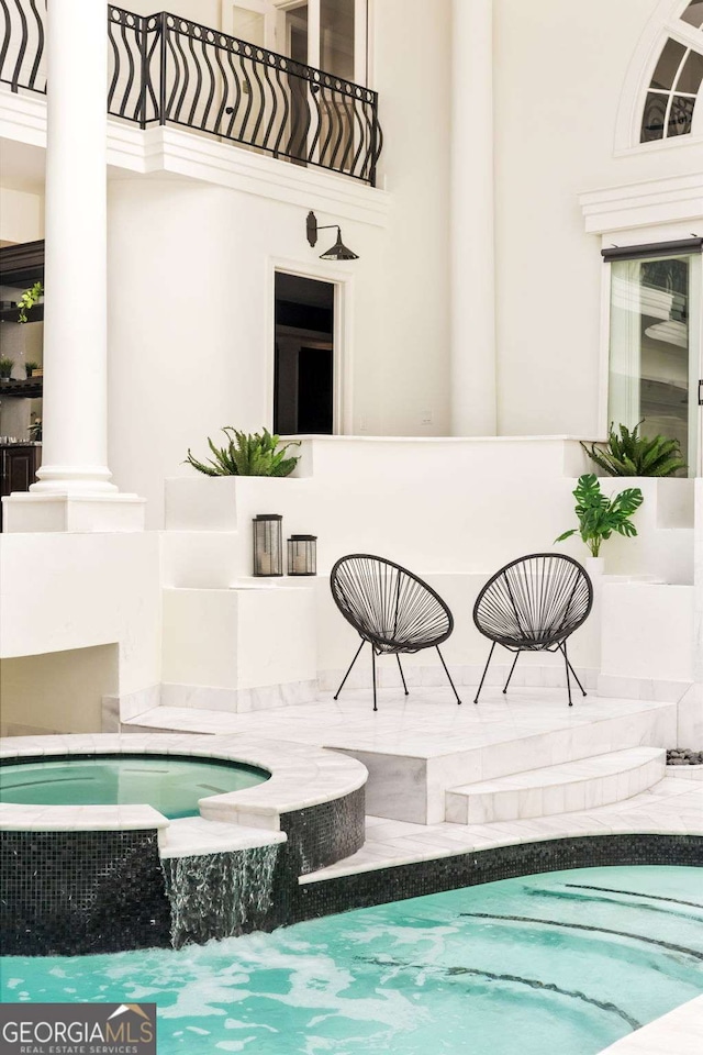 3511 Roxboro Rd NE, Atlanta, GA 30326 - view of pool featuring a pool with connected hot tub and decorative columns