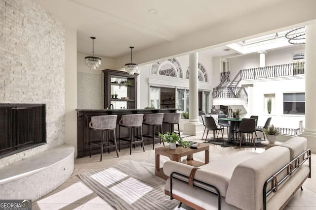 3511 Roxboro Rd NE, Atlanta, GA 30326 - living area featuring bar, a high ceiling, and tile patterned floors